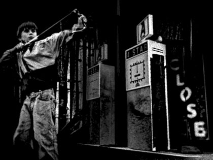 film still: The old garage: My favourite shot from the film. It was also the first time that I learnt you could put textures onto the 3D models inside the 3D application! Up until this point I had been applying them afterwards in Photoshop!! This explains why throughout most of the film the graphics and digital noise float on top of the images and don’t really feel integrated with the scenes. To get the pictures of the children I spent the day cycling around my sister’s village (which partly inspired the film)... and I still feel guilty for telling them that if they had their picture taken they would appear in a big blockbuster film.

