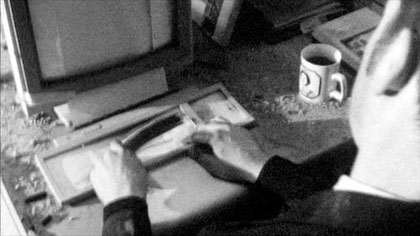film still: Mr Marker (Nick Currey) generates data for his hand-cranked computer (designed by Tadhg O’Sullivan &amp; Guy Bishop)

