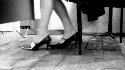 film still: She has precise legs and impressive shoes

