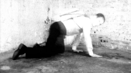film still: Mr Pineska is wound back up and put to work, transporting data

